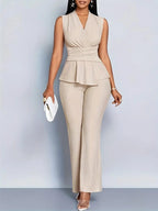 Woman wearing a beige sleeveless top trousers set - studio photo