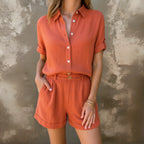 Woman wearing a orange linen short sleeve shirt set - outdoor lifestyle photo