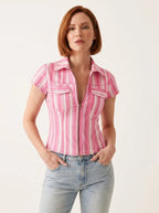Pink and white striped denim-look shirt, studio front view.