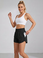 Black running yoga shorts with ruched waistband and zippered side pocket, studio front view.