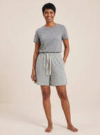 Gray cotton wide-leg shorts with elastic waistband and drawstring, studio front view.