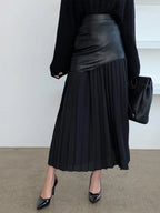Woman wearing a black pleated maxi skirt - lifestyle photo