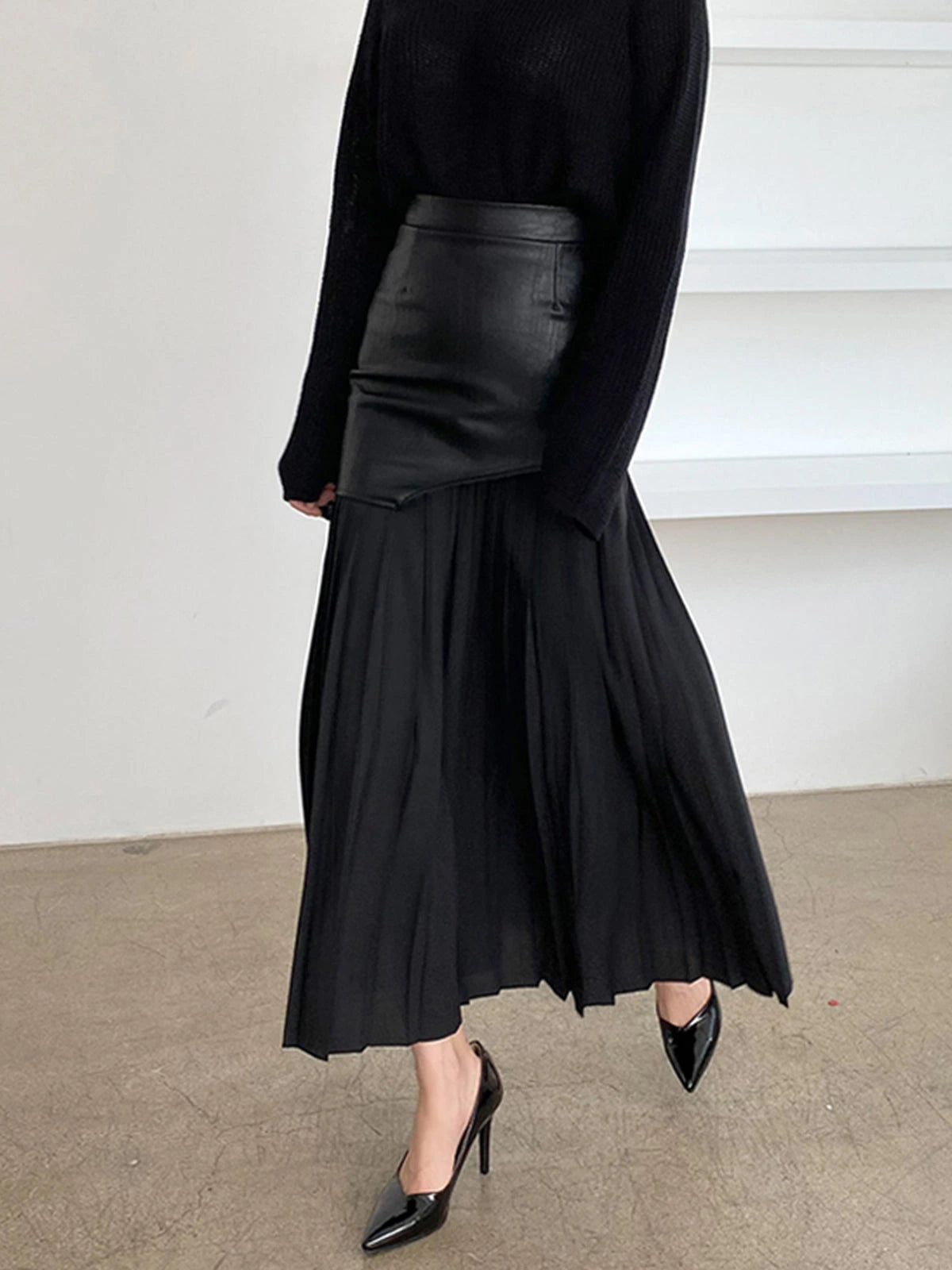 Woman wearing a black pleated maxi skirt - lifestyle photo