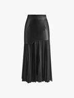 Woman wearing a black pleated maxi skirt - studio photo