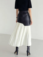 Woman wearing a white pleated maxi skirt - lifestyle photo
