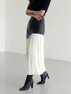 Woman wearing a white pleated maxi skirt - lifestyle photo