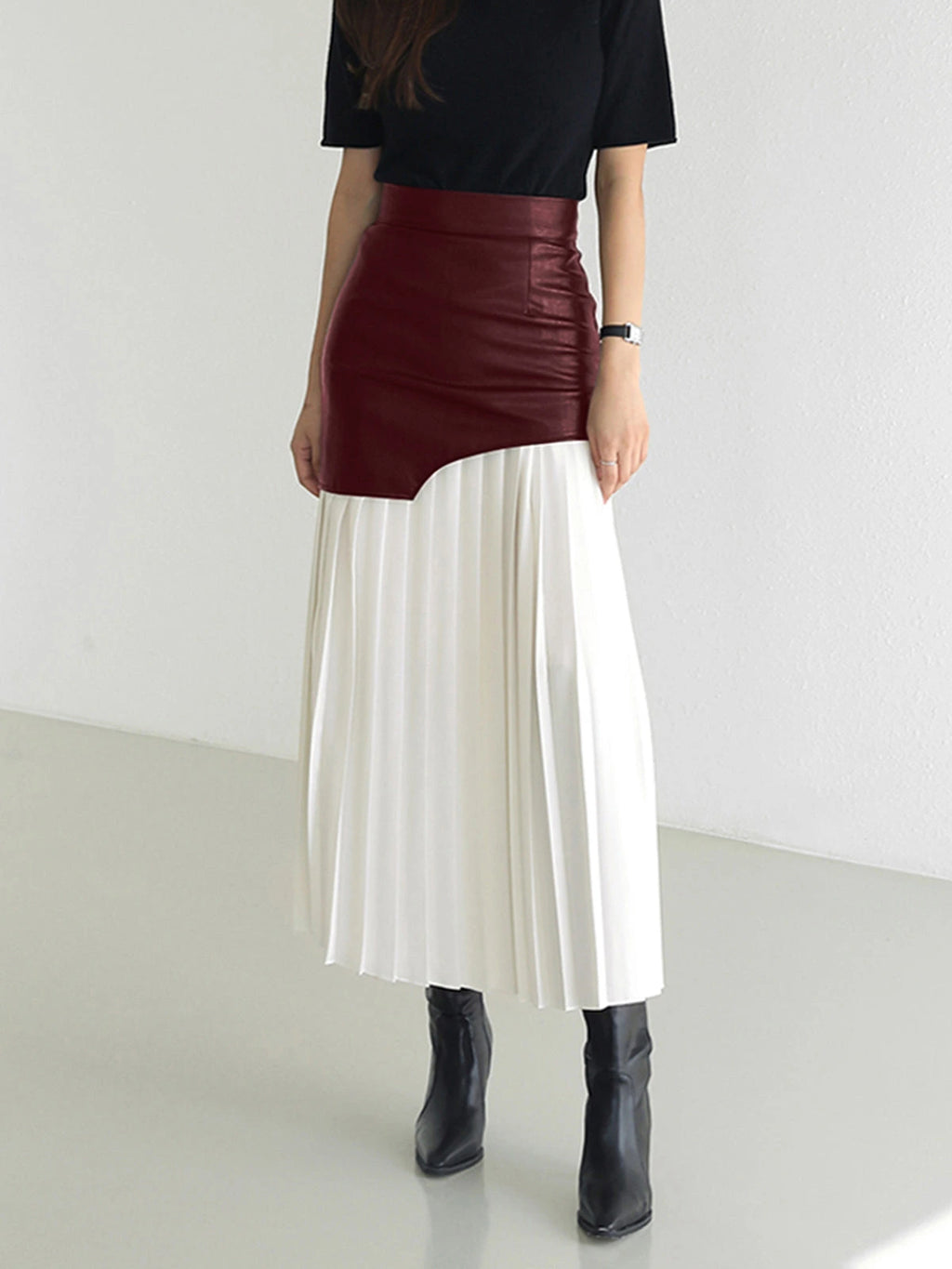 Woman wearing a white pleated maxi skirt - lifestyle photo