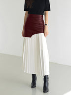 Woman wearing a white pleated maxi skirt - lifestyle photo