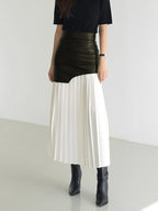 Woman wearing a white pleated maxi skirt - lifestyle photo
