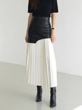 Woman wearing a white pleated maxi skirt - lifestyle photo