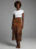 Woman wearing a brown suede fringe ruffle split midi skirt in a studio setting