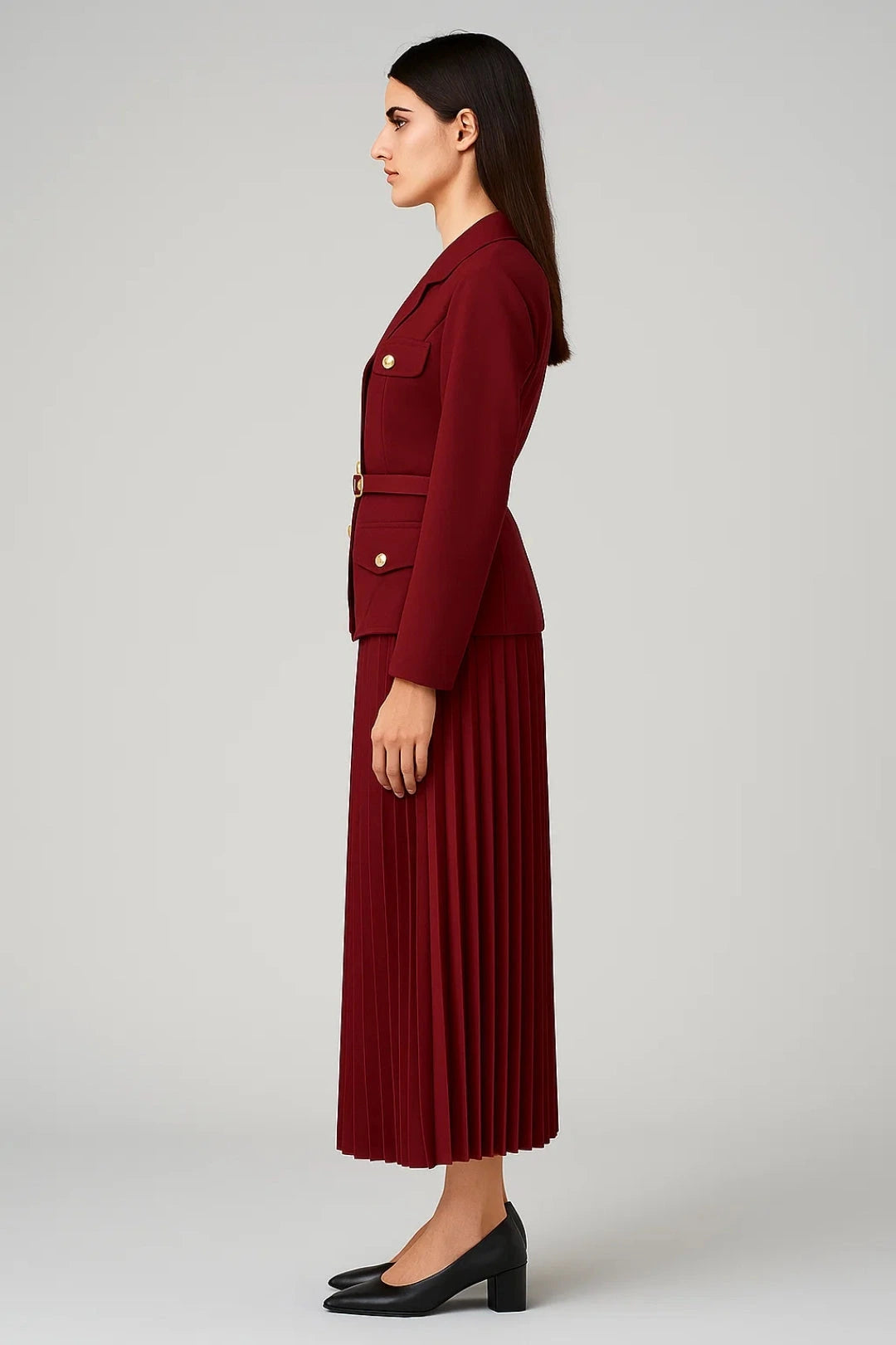 Woman wearing a dark red elegant two-piece skirt set - studio photo