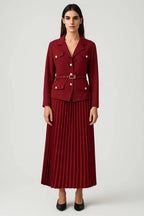 Woman wearing a dark red elegant two-piece skirt set - studio photo