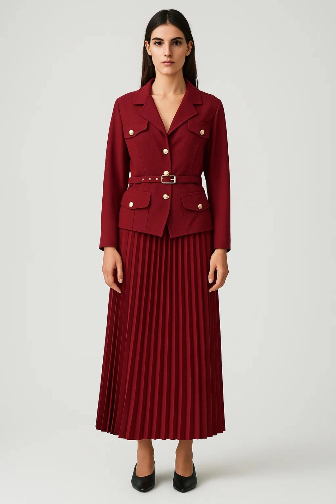 Woman wearing a dark red elegant two-piece skirt set - studio photo