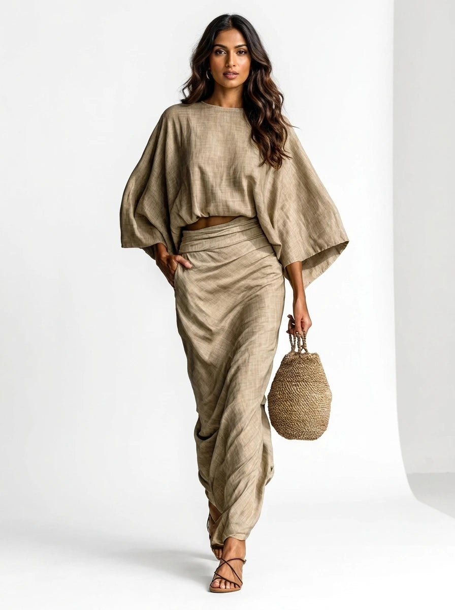 Woman wearing a khaki two-piece coordinating skirt set, studio setting