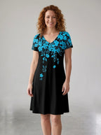 Driftly women's black and blue floral 3D print V-neck A-line sundress, in a minimalist studio setting.
