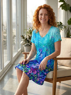 Driftly women's blue floral 3D print V-neck A-line sundress, seated in a bright sunlit interior.