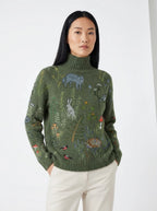 Army green turtleneck sweater with woodland animal print, studio portrait