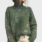 Army green turtleneck sweater with woodland animal print, front view