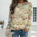 Driftly beige floral embroidered cotton crew neck sweater on model, indoor