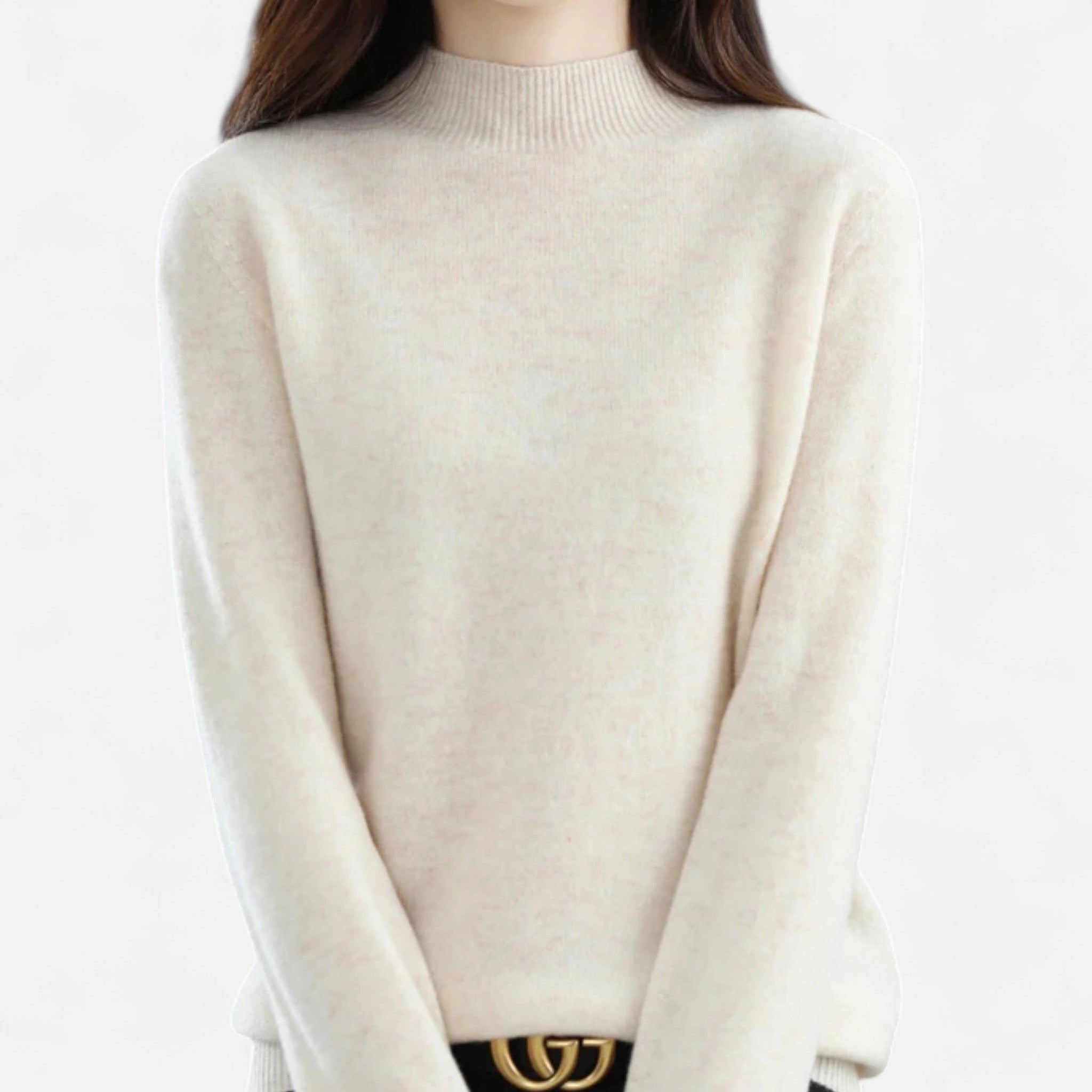 Woman wearing a beige wool half-neck sweater in a studio setting