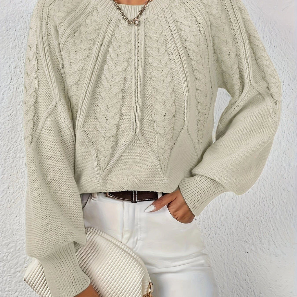 Woman wearing a beige voluminous sleeve sweater with cable knit texture