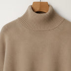 Beige turtleneck sweater, close-up of ribbed collar