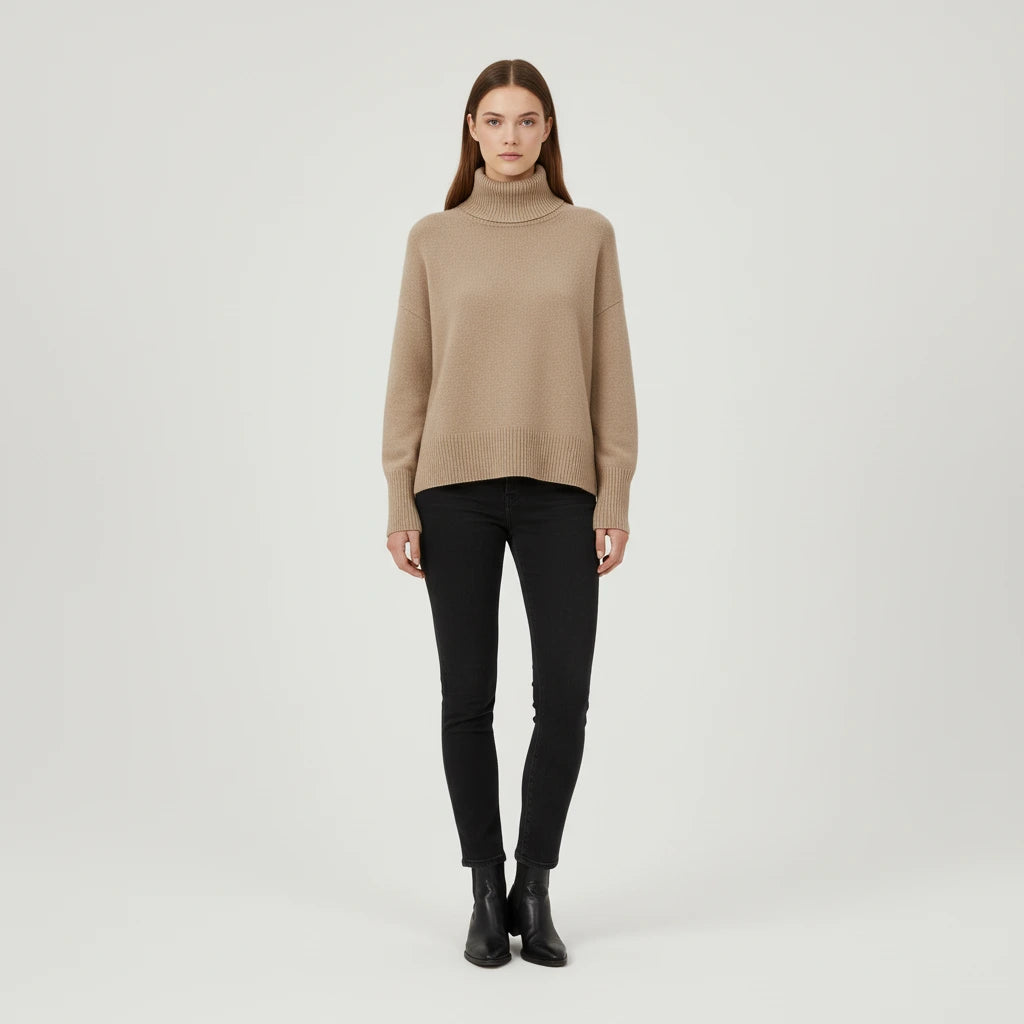 Beige oversized turtleneck sweater with dropped shoulders, front view