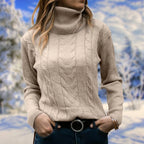 Beige cable-knit turtleneck sweater on model