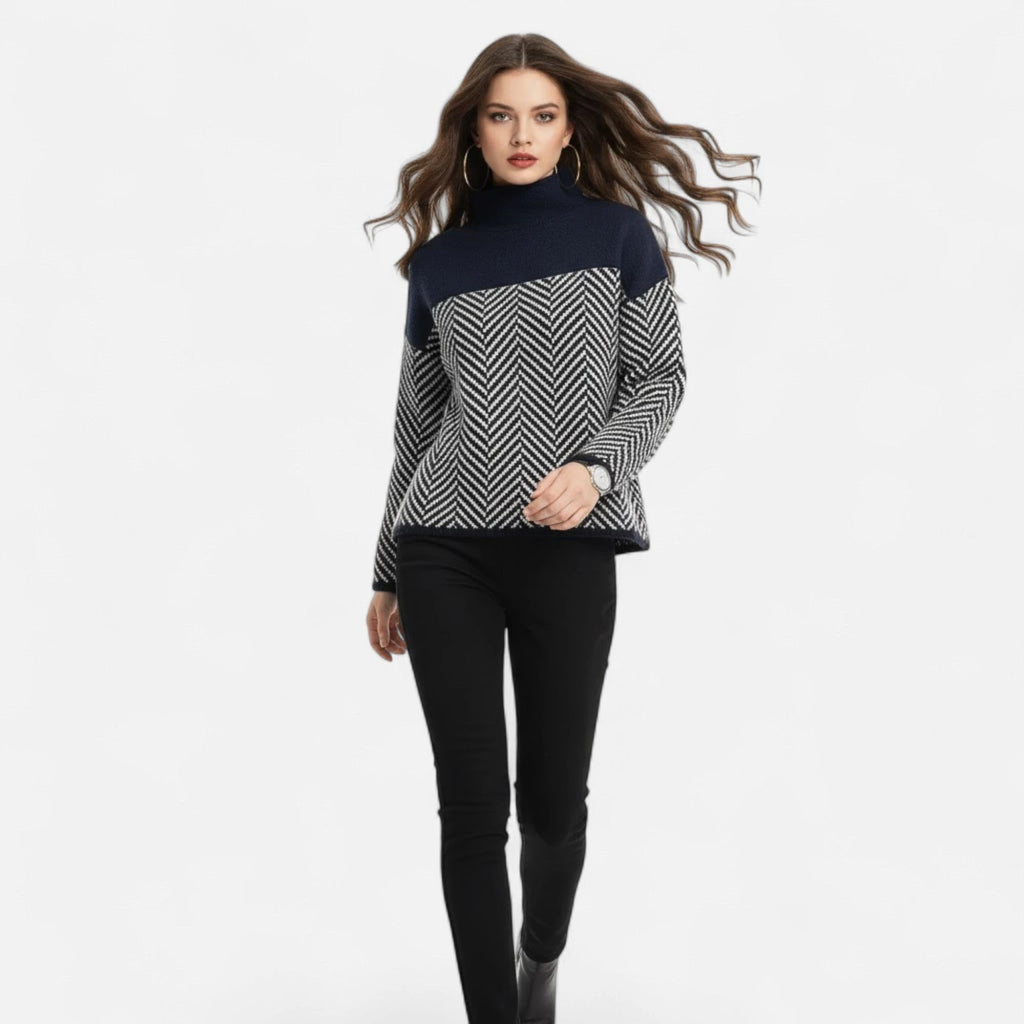 Woman wearing black and grey colorblock wool turtleneck knit sweater