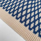 Blue patterned collared sweater, back view