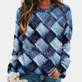 Woman wearing a blue colorblock diamond knit sweater with long sleeves