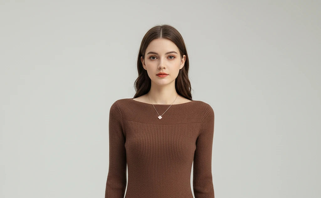 Close-up of brown ribbed boat neck sweater neckline
