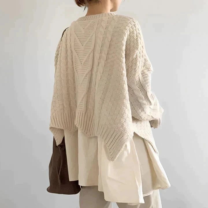 Cream cable knit sweater, hem and cuff detail