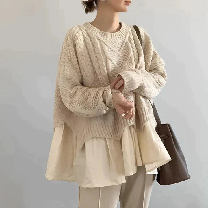 Cream cable knit round neck sweater with layered hem, front view