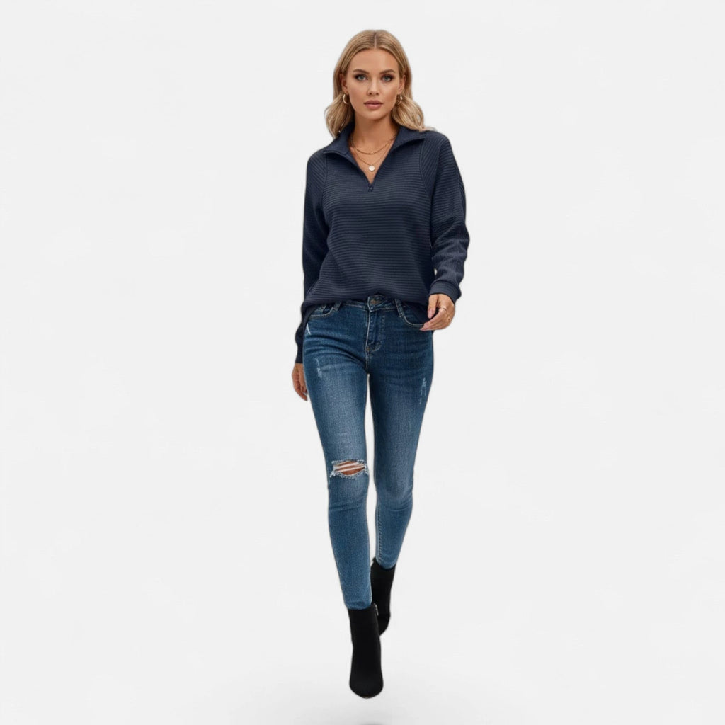 Woman wearing dark blue zipper stand-collar ribbed knit sweater