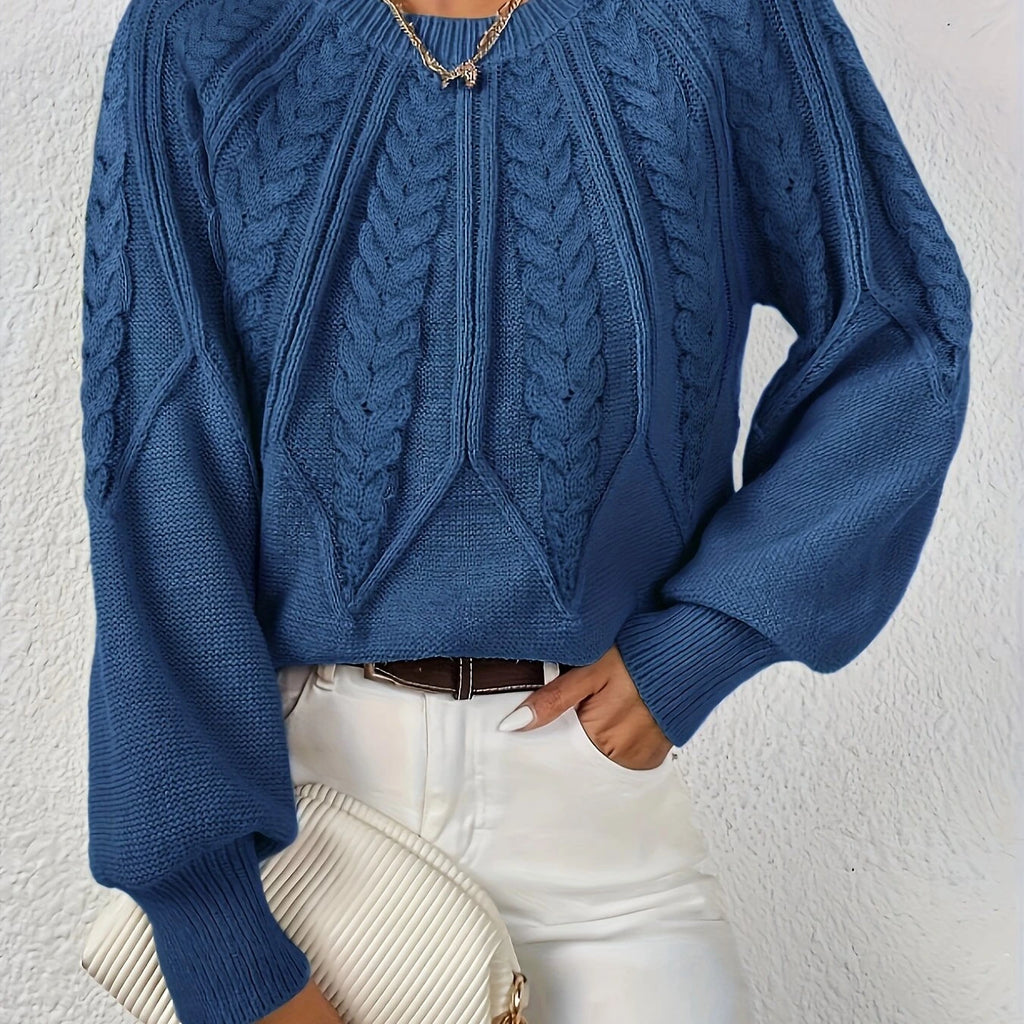 Woman wearing a dark blue voluminous sleeve sweater with cable knit texture