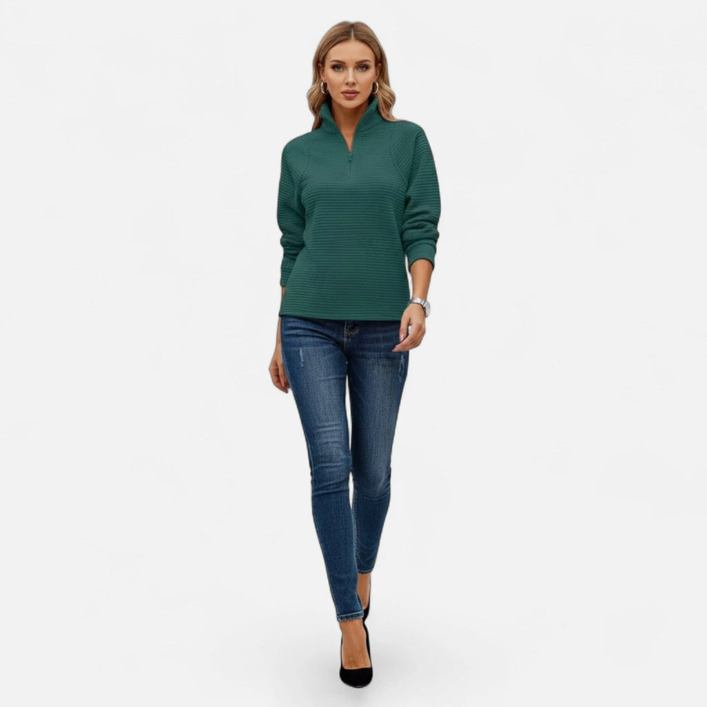 Woman wearing dark green zipper stand-collar ribbed knit sweater