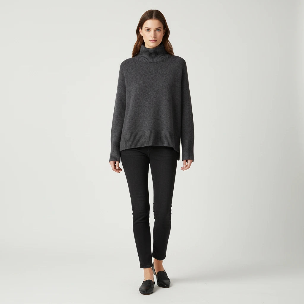 Dark grey oversized turtleneck sweater with dropped shoulders, front view