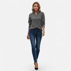 Woman wearing grey zipper stand-collar ribbed knit sweater