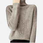 Khaki ribbed turtleneck sweater, close-up neckline detail