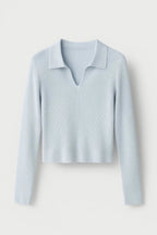 Light blue ribbed cropped V-neck sweater with collar, flat lay