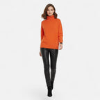 Orange oversized turtleneck sweater on model