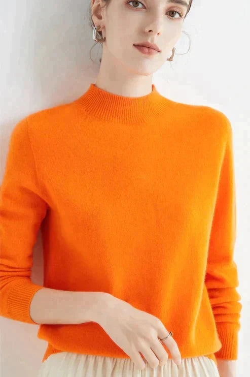 Driftly orange ribbed mock neck knit sweater on model