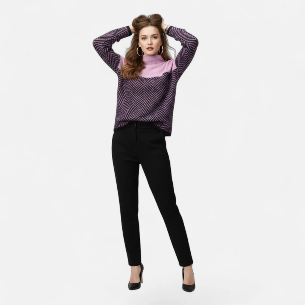 Woman wearing purple and lilac colorblock wool turtleneck knit sweater
