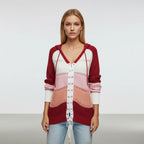 Red hooded lace-up sweater with openwork panels, front view
