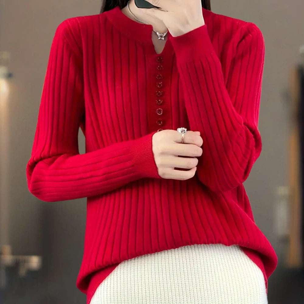 Woman wearing a red ribbed knit sweater with button placket, lifestyle shot