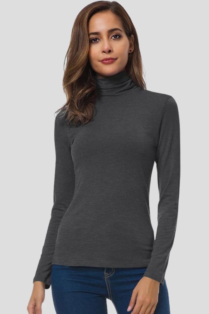 Woman wearing a dark grey turtleneck long sleeve plain sweater - studio photo