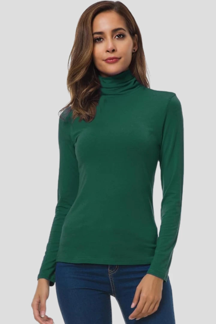 Woman wearing a green turtleneck long sleeve plain sweater - studio photo