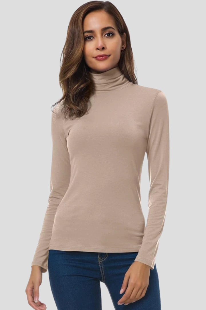 Woman wearing a khaki turtleneck long sleeve plain sweater - studio photo